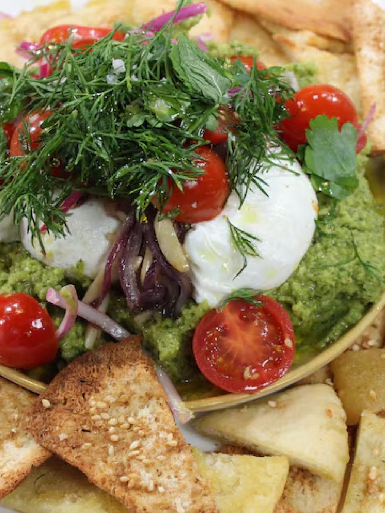 Avocado & broad bean bessara with poached egg & crispy pita